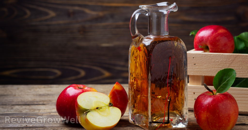 apple cider vinegar on wooden table
